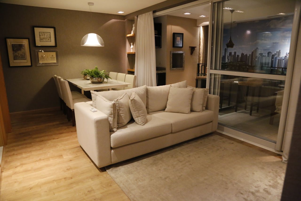 services-03 Cozy living room with modern furniture and dining area, perfect for stylish home interiors.
