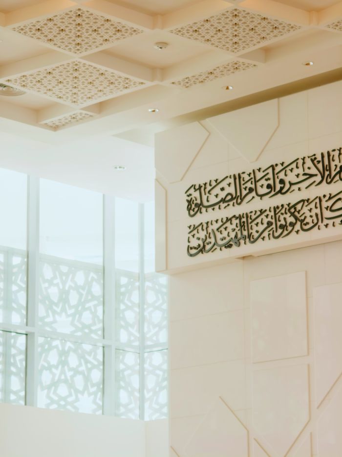 gallery-4 Elegant interior design of a mosque in Malaysia showcasing Islamic calligraphy and motifs.